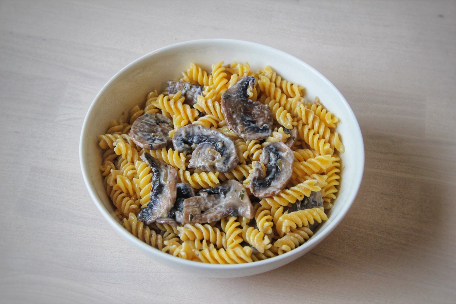 Bowl of pastas with some creamy mushrooms on top